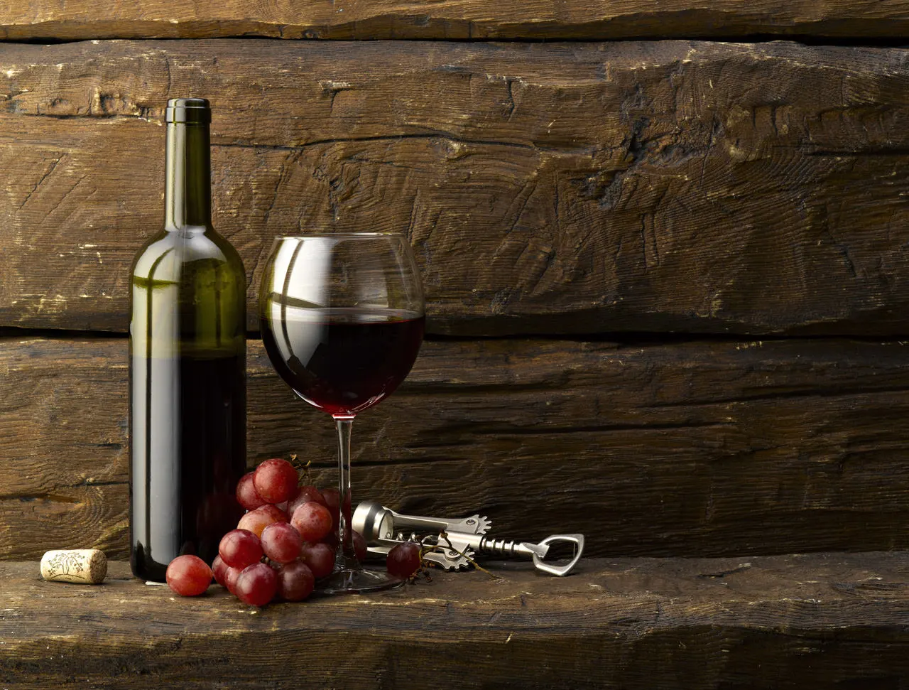 Grapes with bottle and glass of red wine